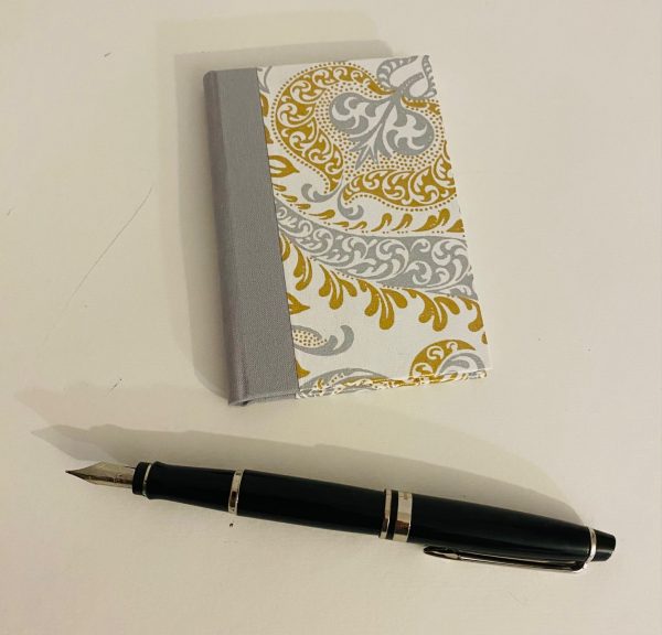 small notebook white silver and gold