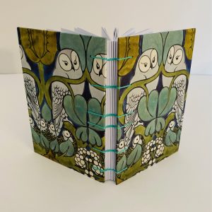 coptic bound journal with owls on the cover
